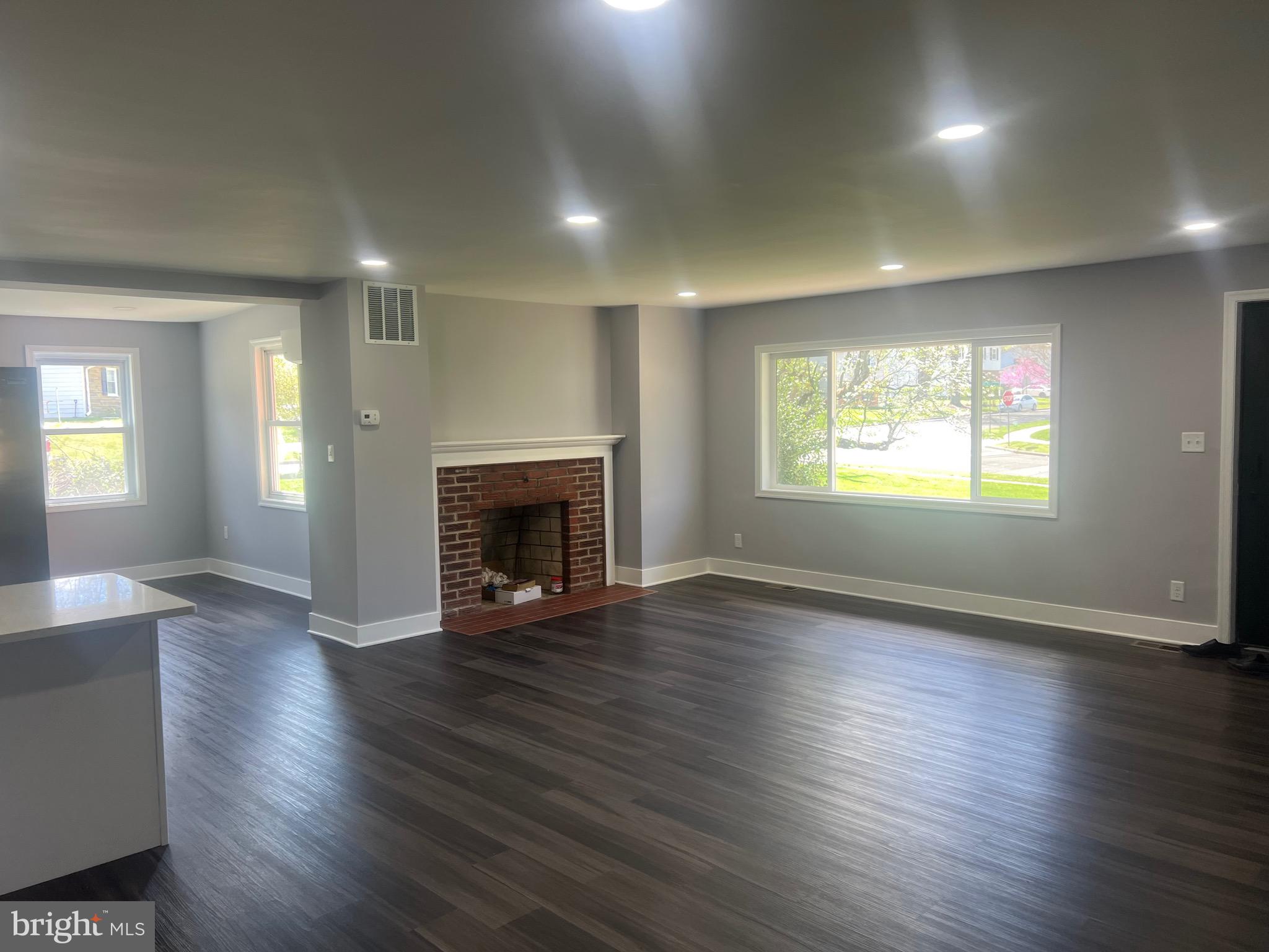 2600 Kingsway Road Fort Washington, MD 20744 - Photo 28 of 37 an empty room with wooden floor fireplace and windows
