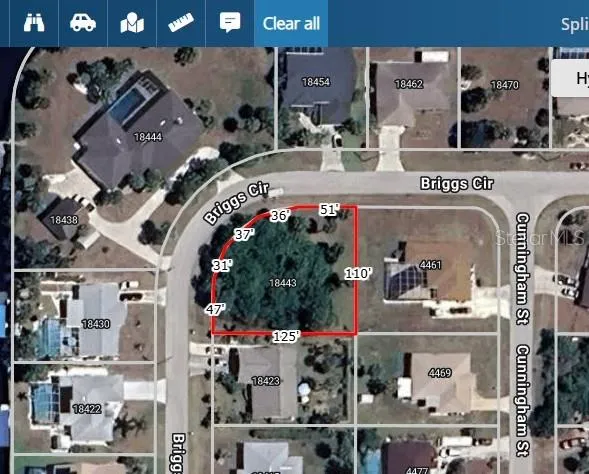 a view of a garden with a building