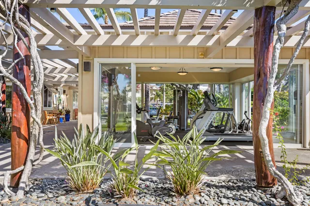 a view of a patio with table and chairs and potted plants