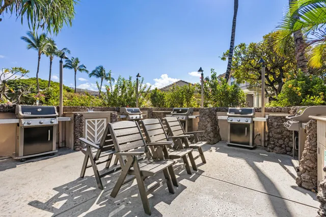 a view of a chairs and table in the patio