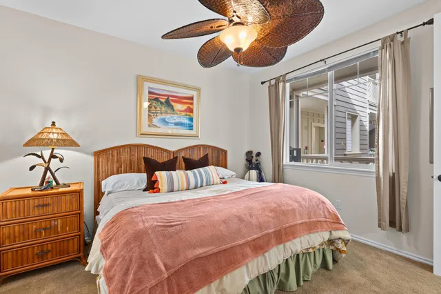 a bedroom with bed and window