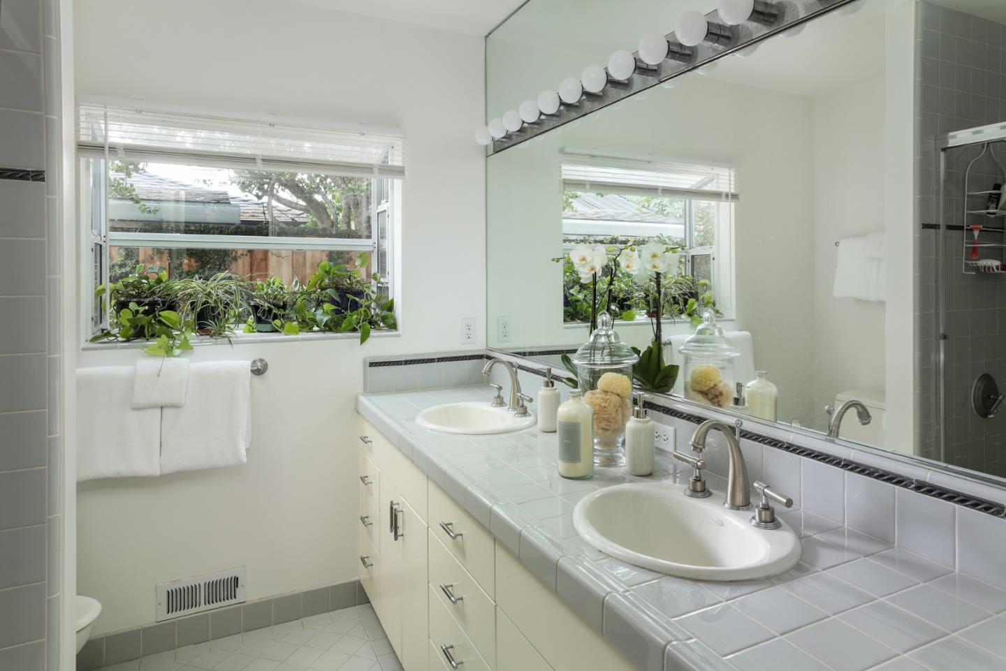 165 Pineview Lane Menlo Park, CA 94025 - Photo 8 of 13 a bathroom with a double vanity sink and a mirror
