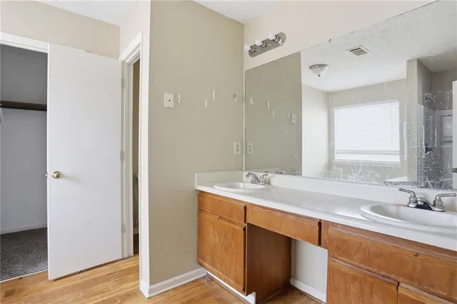 a bathroom with a sink and a mirror
