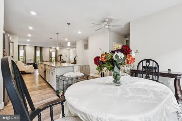 a dining room with furniture and a chandelier