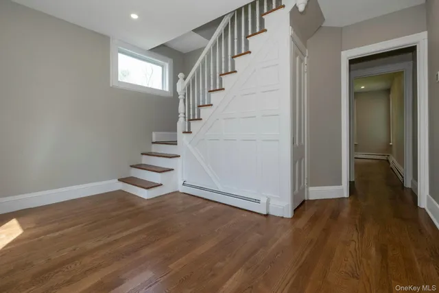 a view of entryway with wooden floor