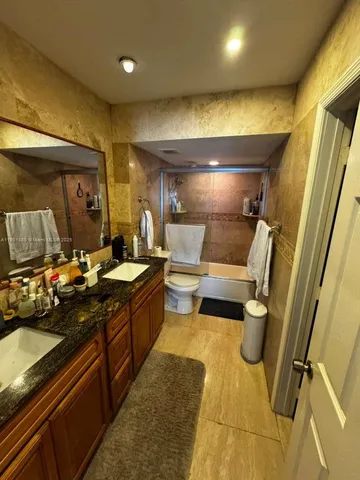 a bathroom with sink and mirror