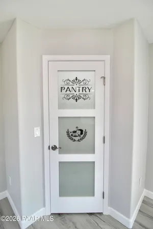 a bathroom with a granite countertop sink a toilet a mirror a bathtub and shower