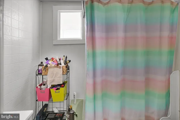 a view of a house with snow on the road