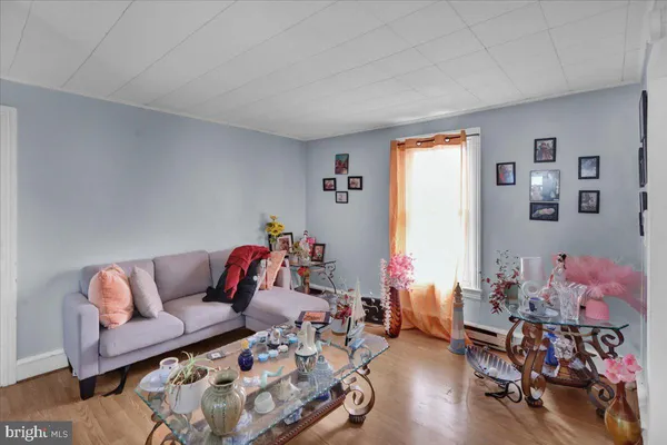 a view of dining room with wooden floor and table chair