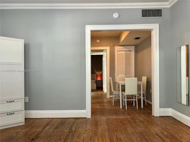 a view of a livingroom with furniture and wooden floor