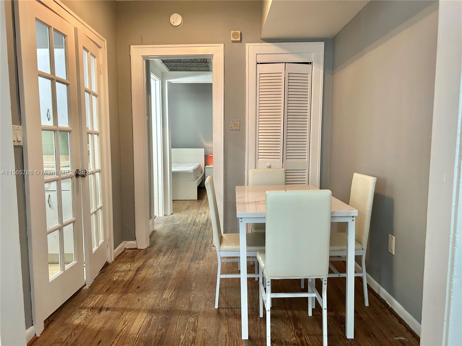 536 14th Street, Unit 107 Miami Beach, FL 33139 - Photo 6 of 13 a dining room with furniture and window