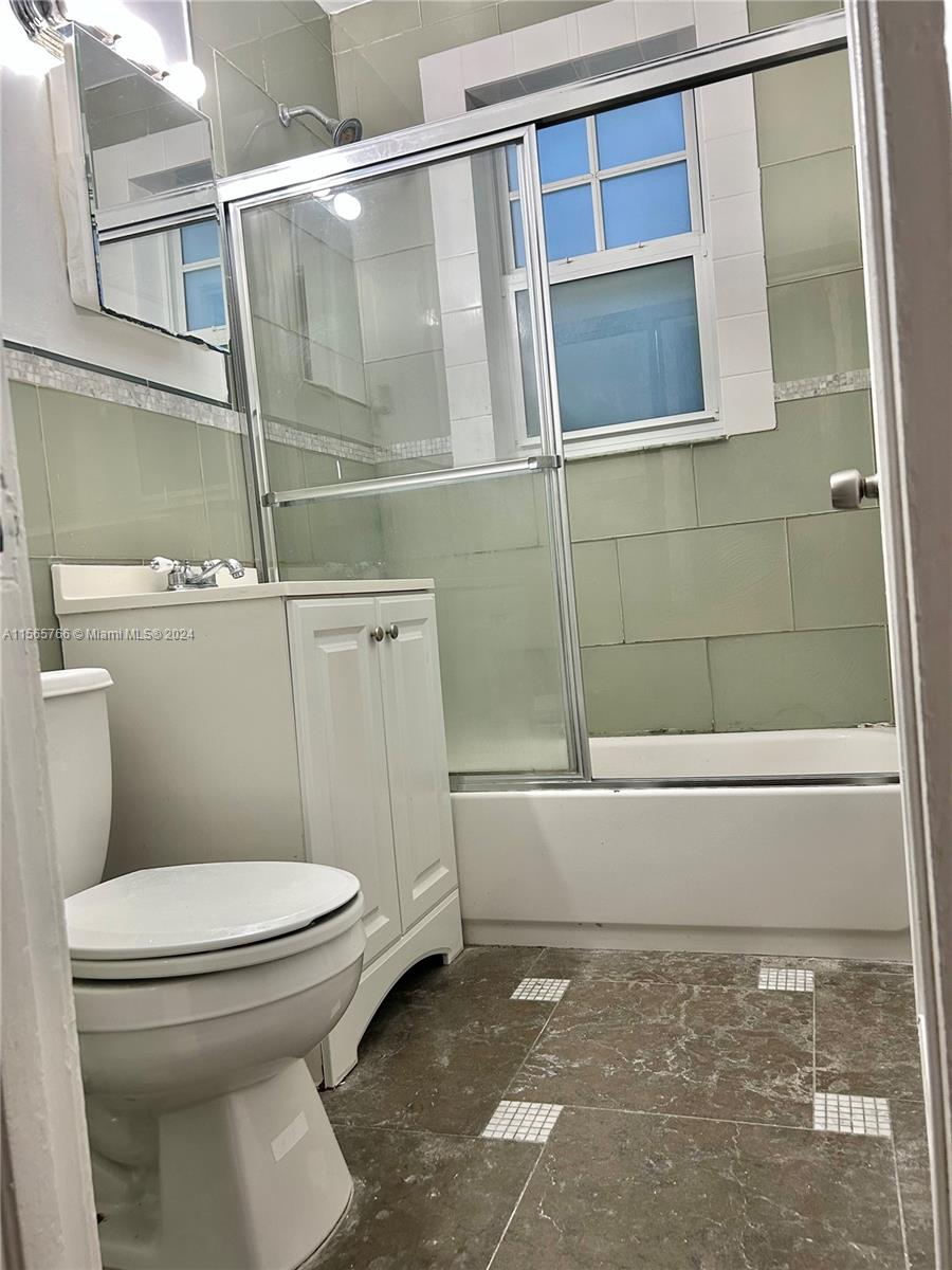 536 14th Street, Unit 107 Miami Beach, FL 33139 - Photo 10 of 13 a bathroom with a toilet and a shower