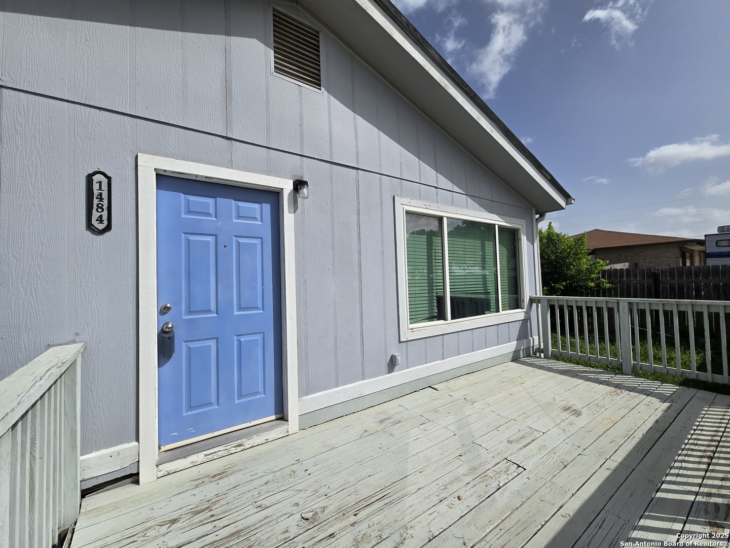 a view of balcony and wooden floor