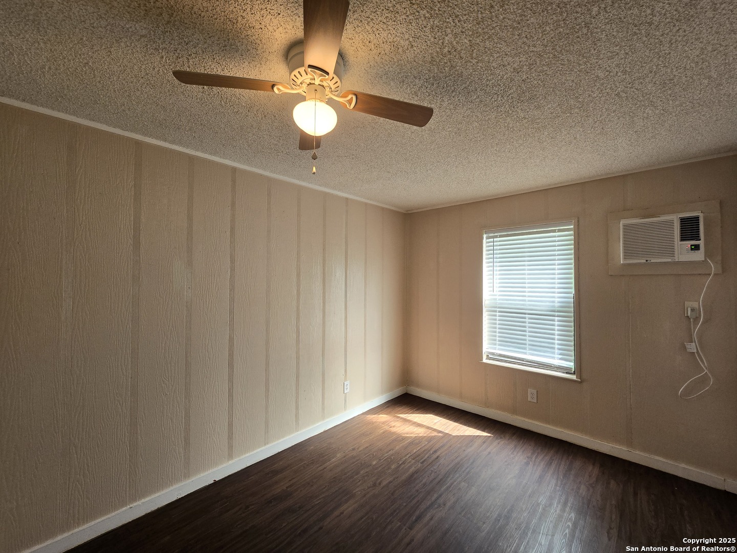 1484 West Klein Road New Braunfels, TX 78130 - Photo 9 of 11 a view of an empty room with wooden floor and a window