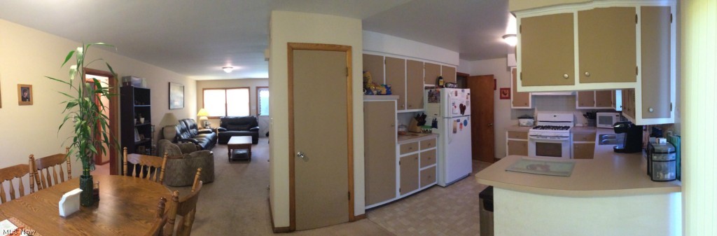 255-259 Swartz Road Akron, OH 44319 - Photo 17 of 21 Dining room, living space, kitchen, sliding door to exterior patio + back yard.-259