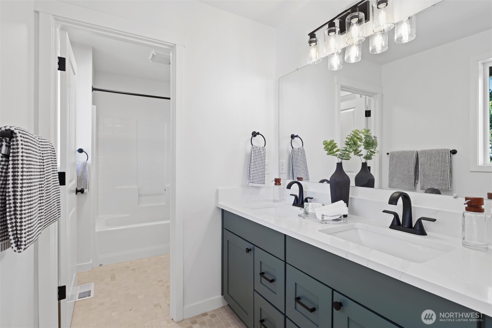 2211 Southwest 103rd Place Seattle, WA 98146 - Photo 14 of 17 a bathroom with a double vanity sink mirror and shower