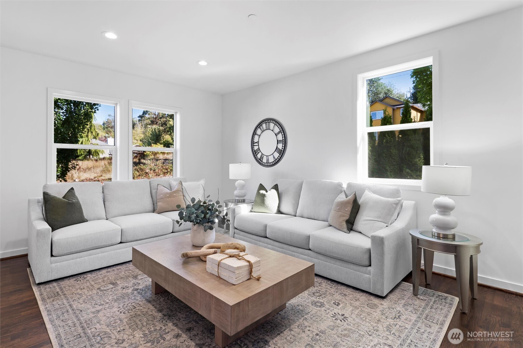 2211 Southwest 103rd Place Seattle, WA 98146 - Photo 5 of 17 a living room with furniture a rug and a window