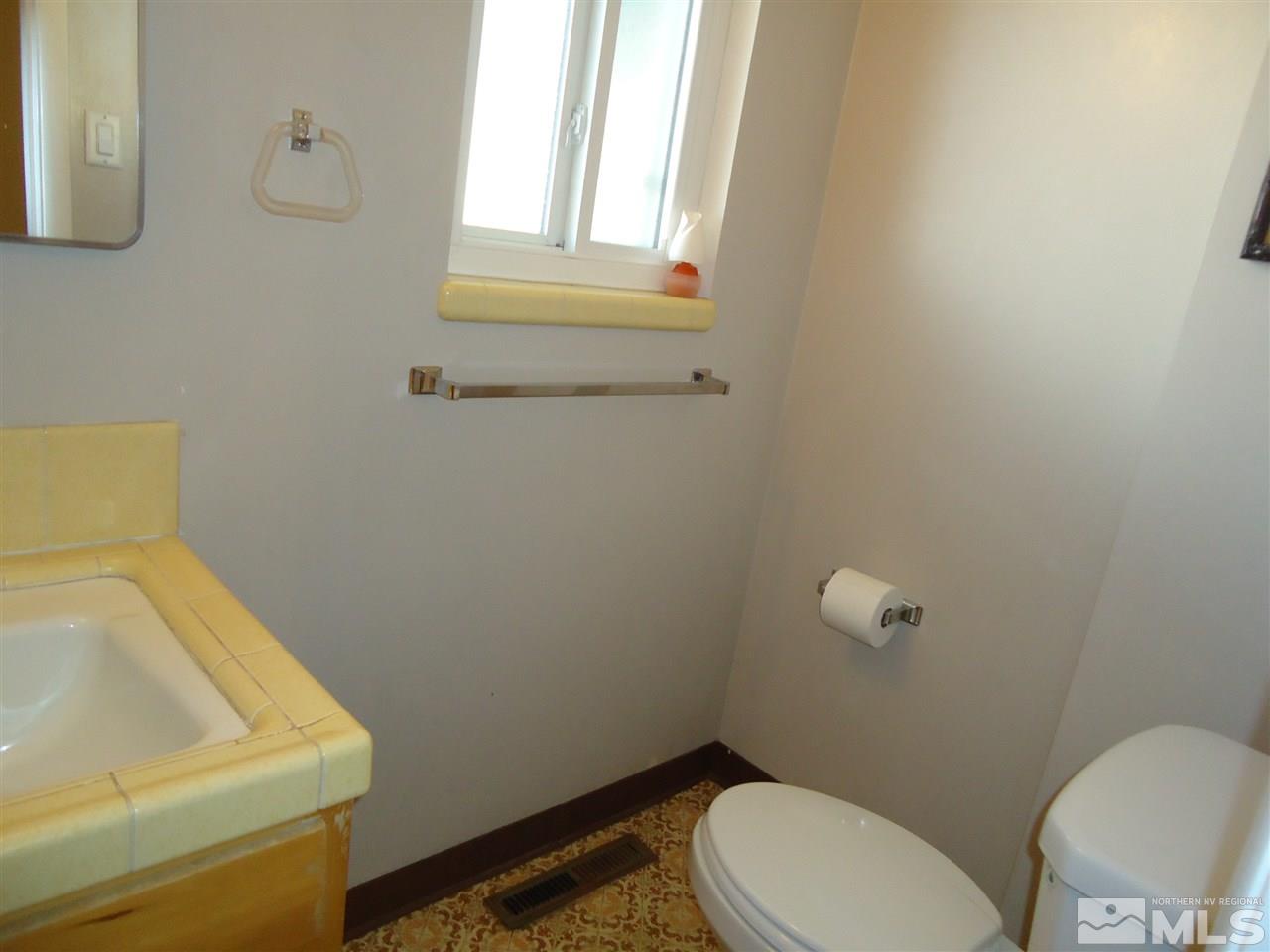 645 Harbin Lane Reno, NV 89509 - Photo 13 of 25 a bathroom with a sink and a toilet