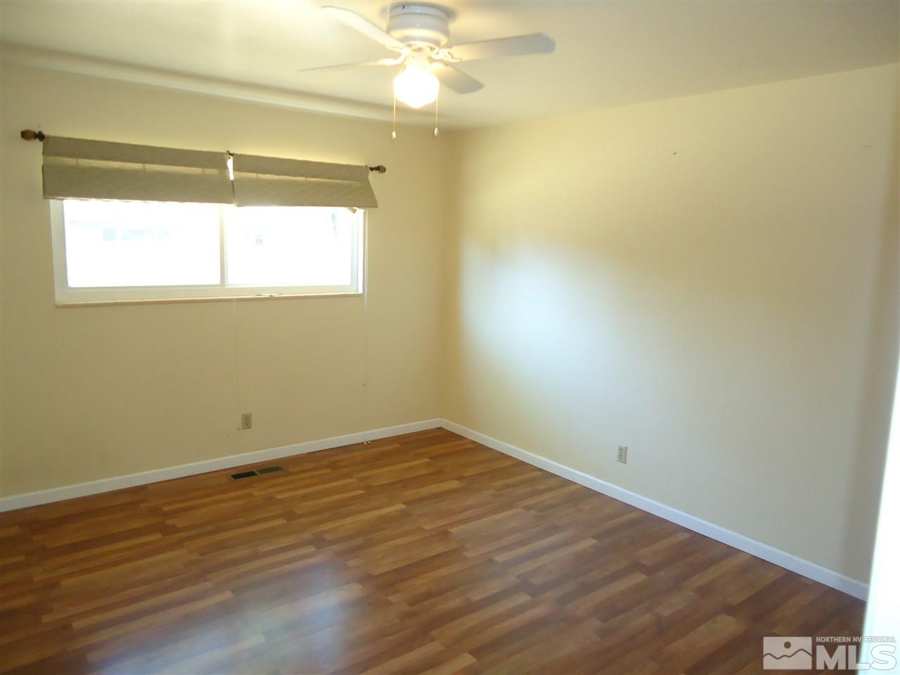 645 Harbin Lane Reno, NV 89509 - Photo 18 of 25 a view of a small space with wooden floor and a window
