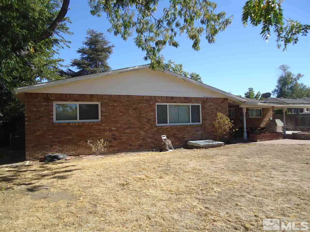 645 Harbin Lane Reno, NV 89509 - Photo 19 of 25 a front view of a house with a yard