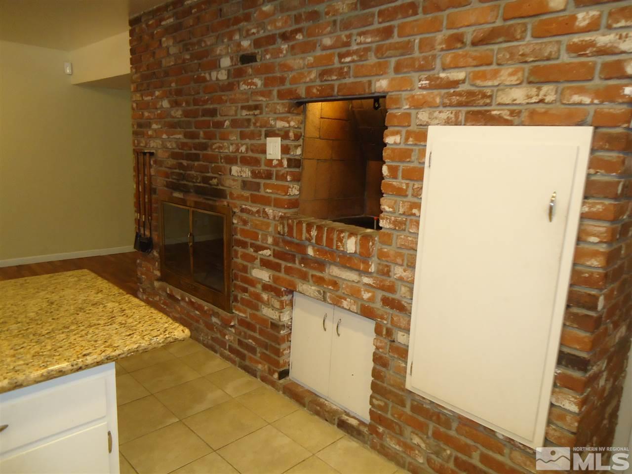 645 Harbin Lane Reno, NV 89509 - Photo 4 of 25 a bathroom with a granite countertop shower and a sink