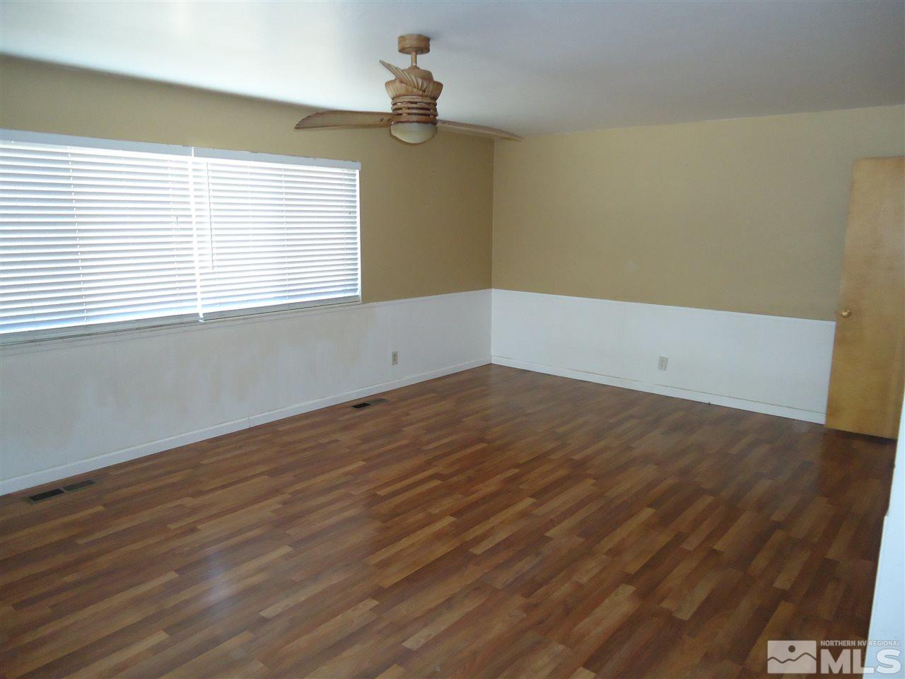 645 Harbin Lane Reno, NV 89509 - Photo 7 of 25 wooden floor in an empty room with a window