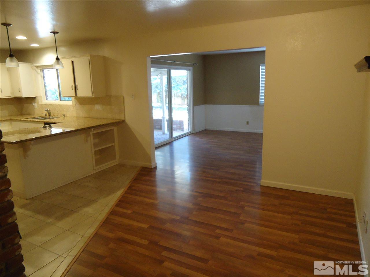 645 Harbin Lane Reno, NV 89509 - Photo 8 of 25 a view of a kitchen with wooden floor and a sink