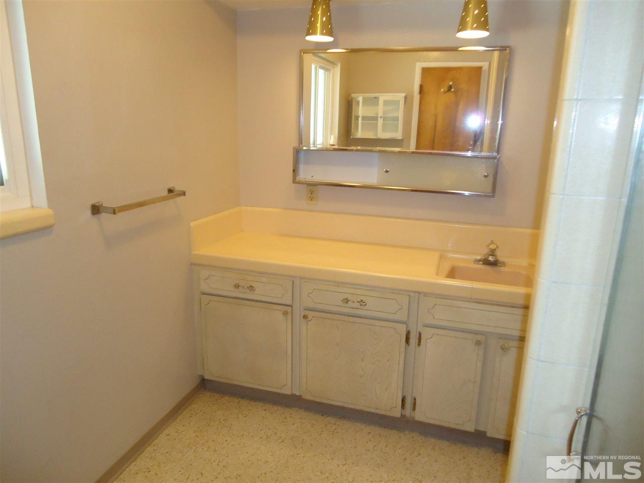 645 Harbin Lane Reno, NV 89509 - Photo 10 of 25 a bathroom with a sink and a mirror