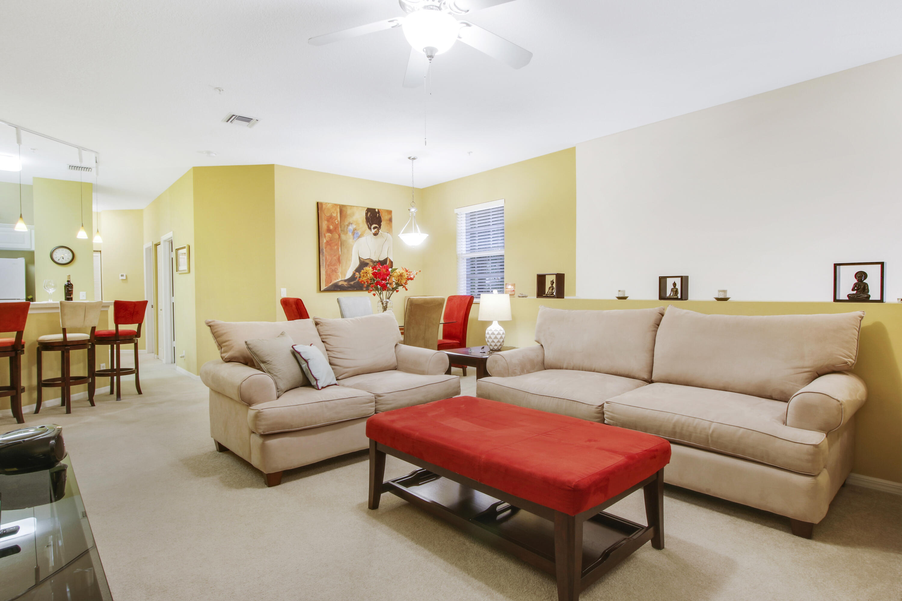 108 Lighthouse Circle, Unit B Jupiter, FL 33469 - Photo 1 of 33 a living room with furniture a table and a potted plant