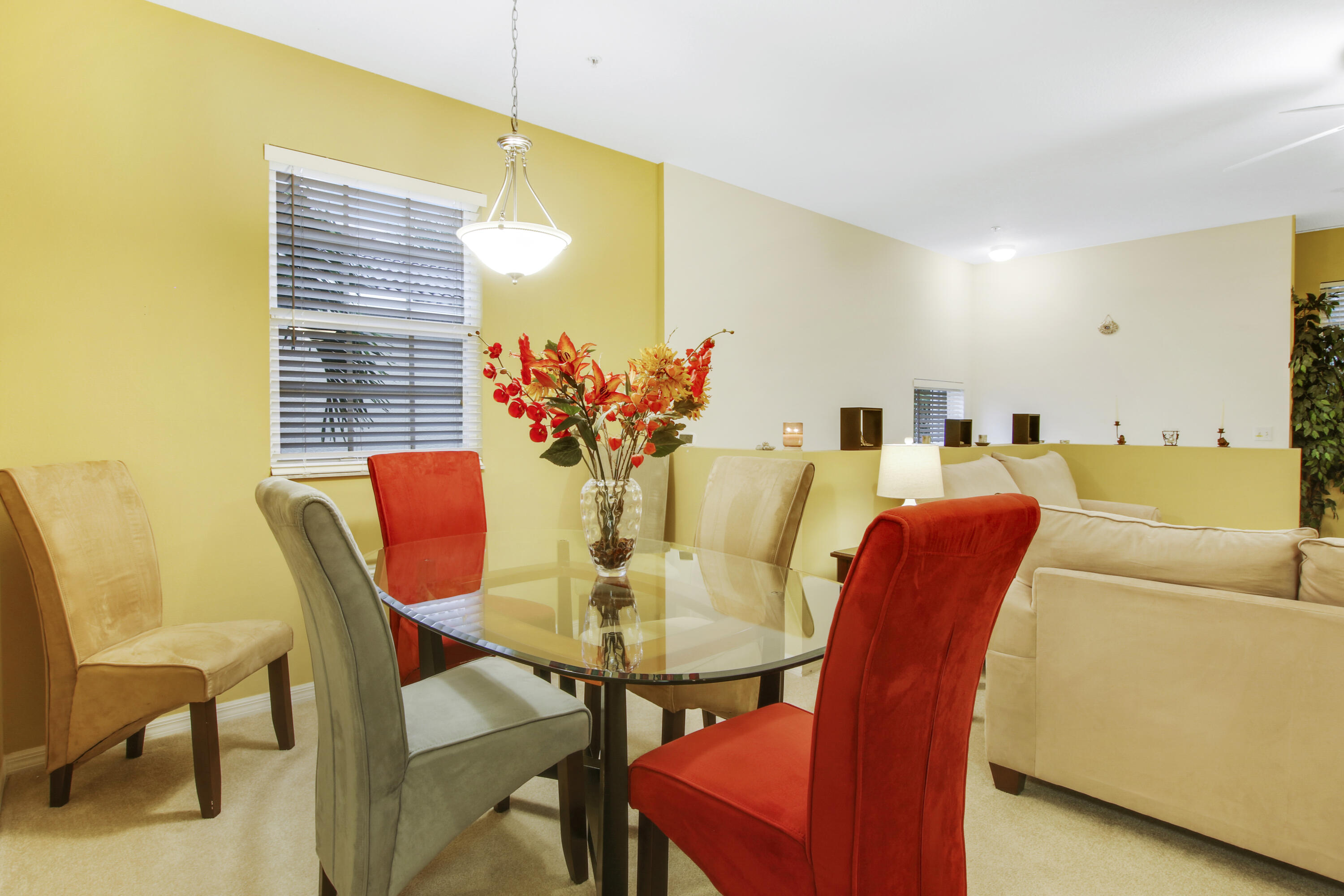 108 Lighthouse Circle, Unit B Jupiter, FL 33469 - Photo 11 of 33 a view of a dining room with furniture and a potted plant