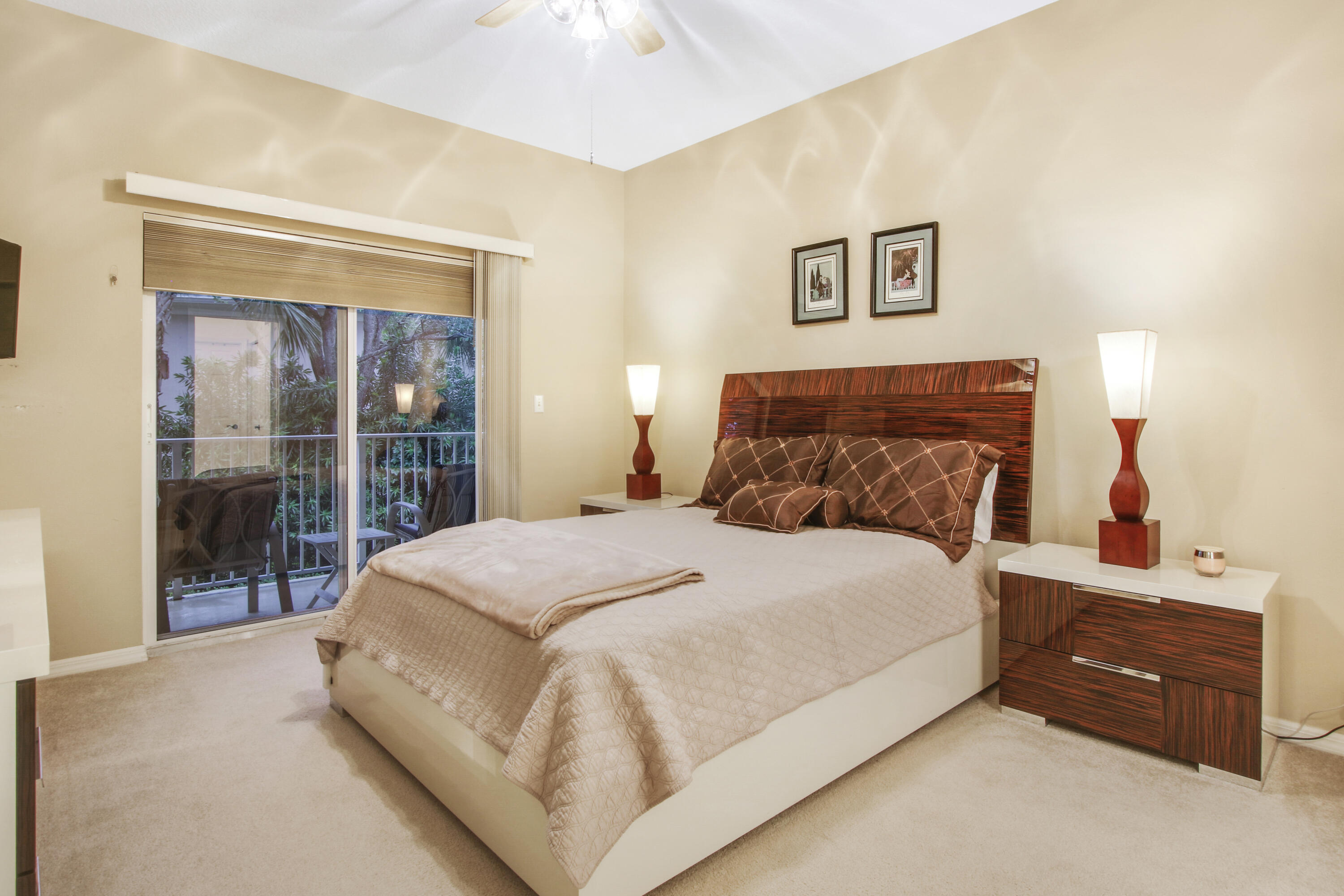 108 Lighthouse Circle, Unit B Jupiter, FL 33469 - Photo 17 of 33 a large bed sitting in a bedroom next to a window