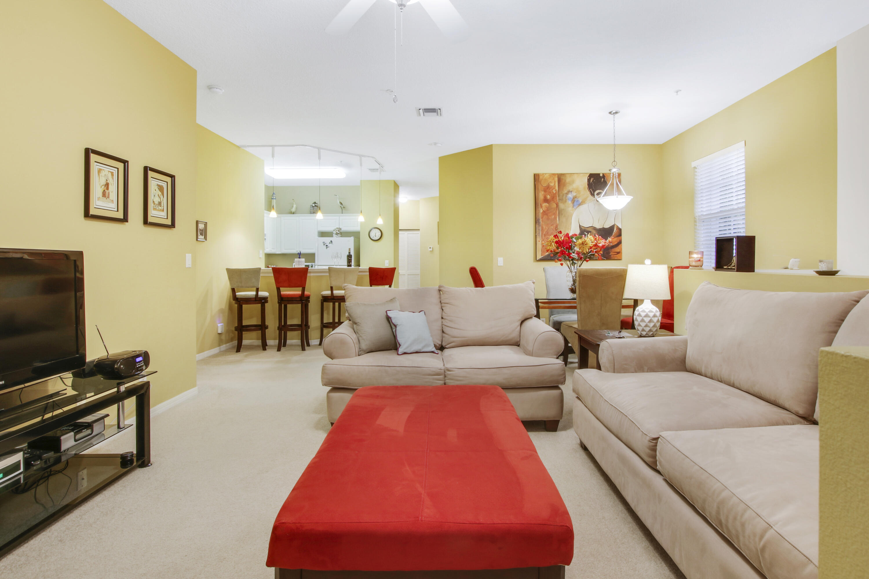 108 Lighthouse Circle, Unit B Jupiter, FL 33469 - Photo 8 of 33 a living room with furniture and a flat screen tv