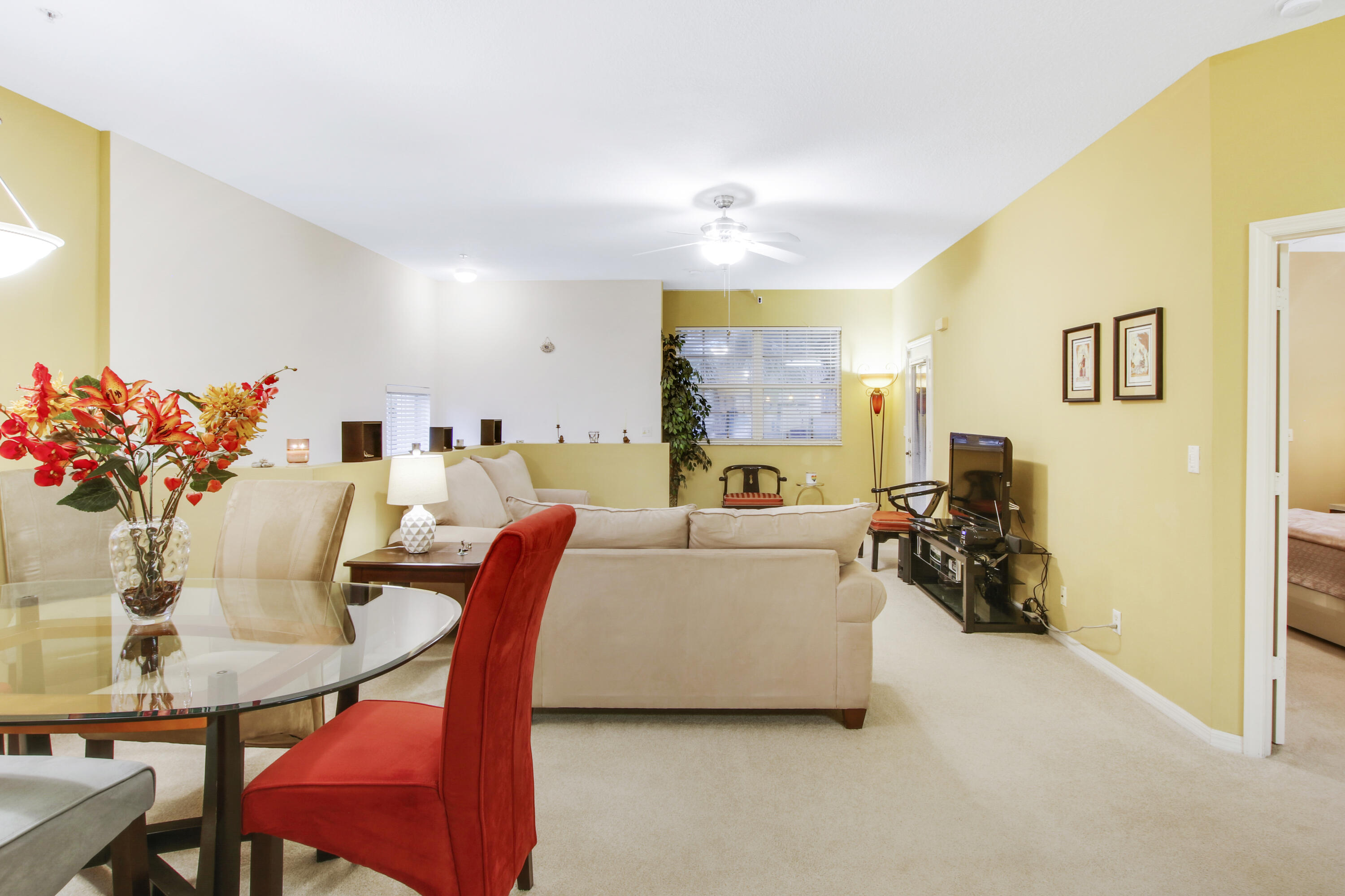 108 Lighthouse Circle, Unit B Jupiter, FL 33469 - Photo 10 of 33 a living room with furniture and a table