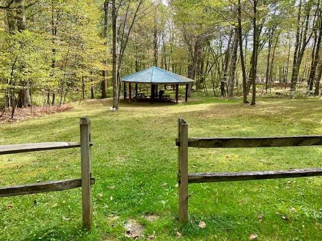 a view of a swimming pool with a table and chairs