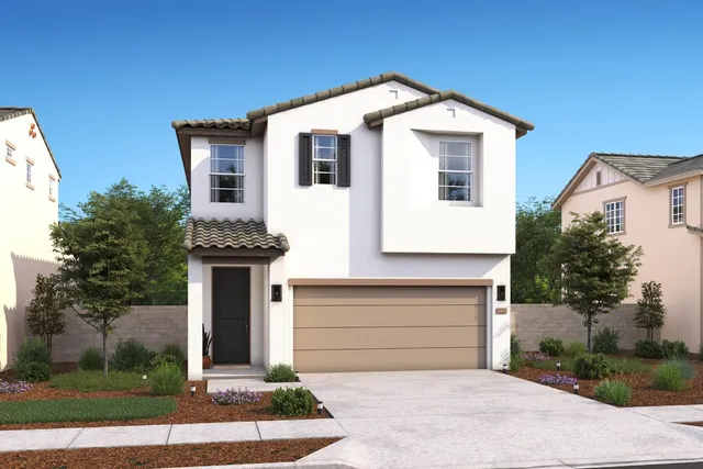 a front view of a house with garage