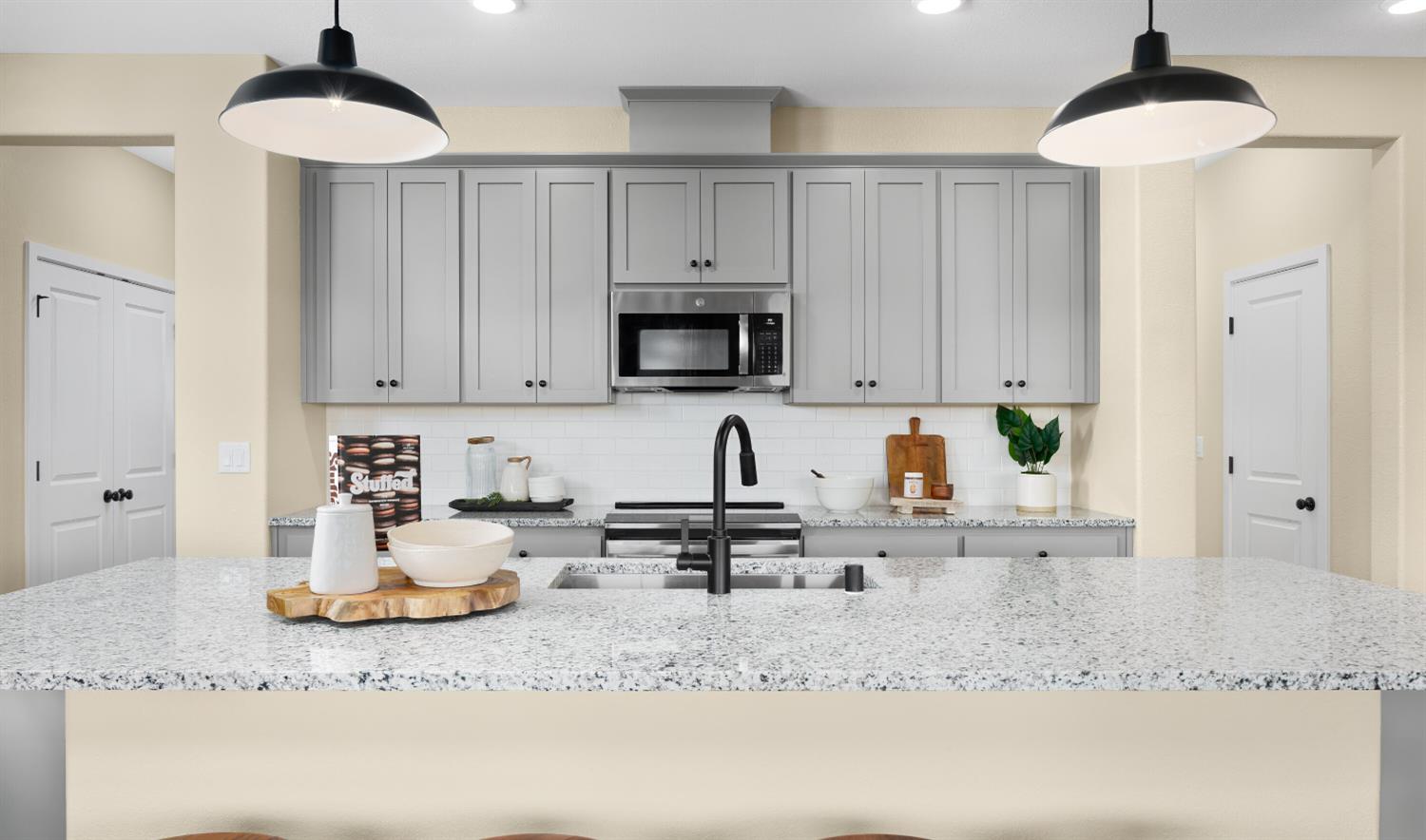 12254 Goldfinch Way Rancho Cordova, CA 95742 - Photo 6 of 19 a kitchen with stainless steel appliances granite countertop a sink a stove and cabinets