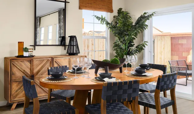 a view of a dining room with furniture and window