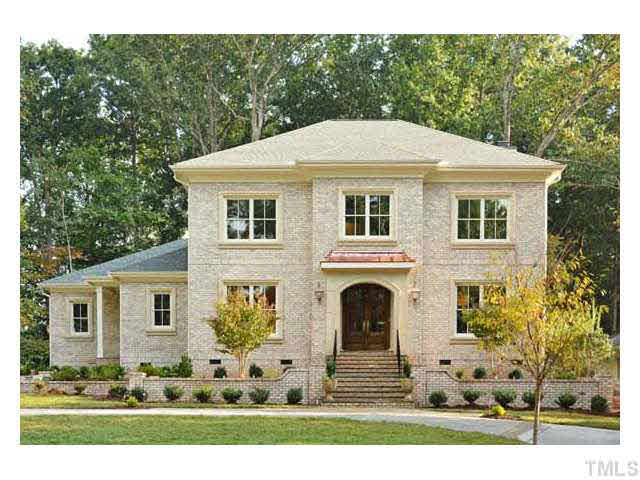 418 Forsyth Street Raleigh, NC 27609 - Photo 1 of 25 a front view of a house with a yard