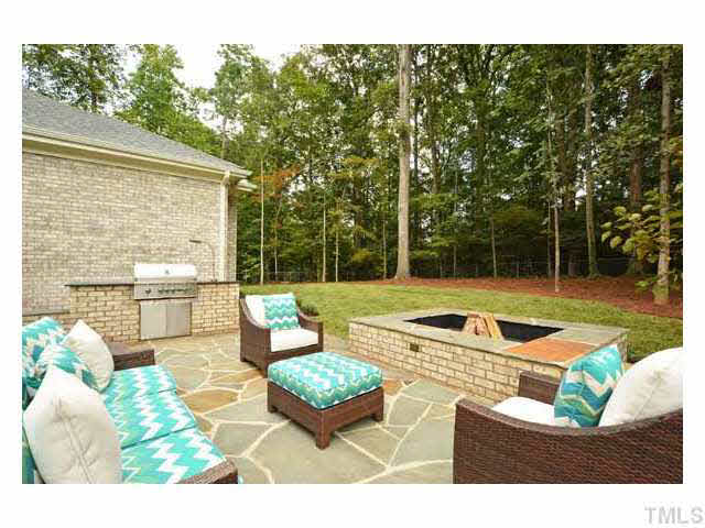 418 Forsyth Street Raleigh, NC 27609 - Photo 13 of 25 a view of a patio with couches table and chairs with wooden floor and fence