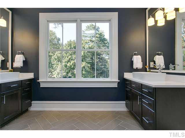 418 Forsyth Street Raleigh, NC 27609 - Photo 21 of 25 a kitchen with a sink cabinets and a large window