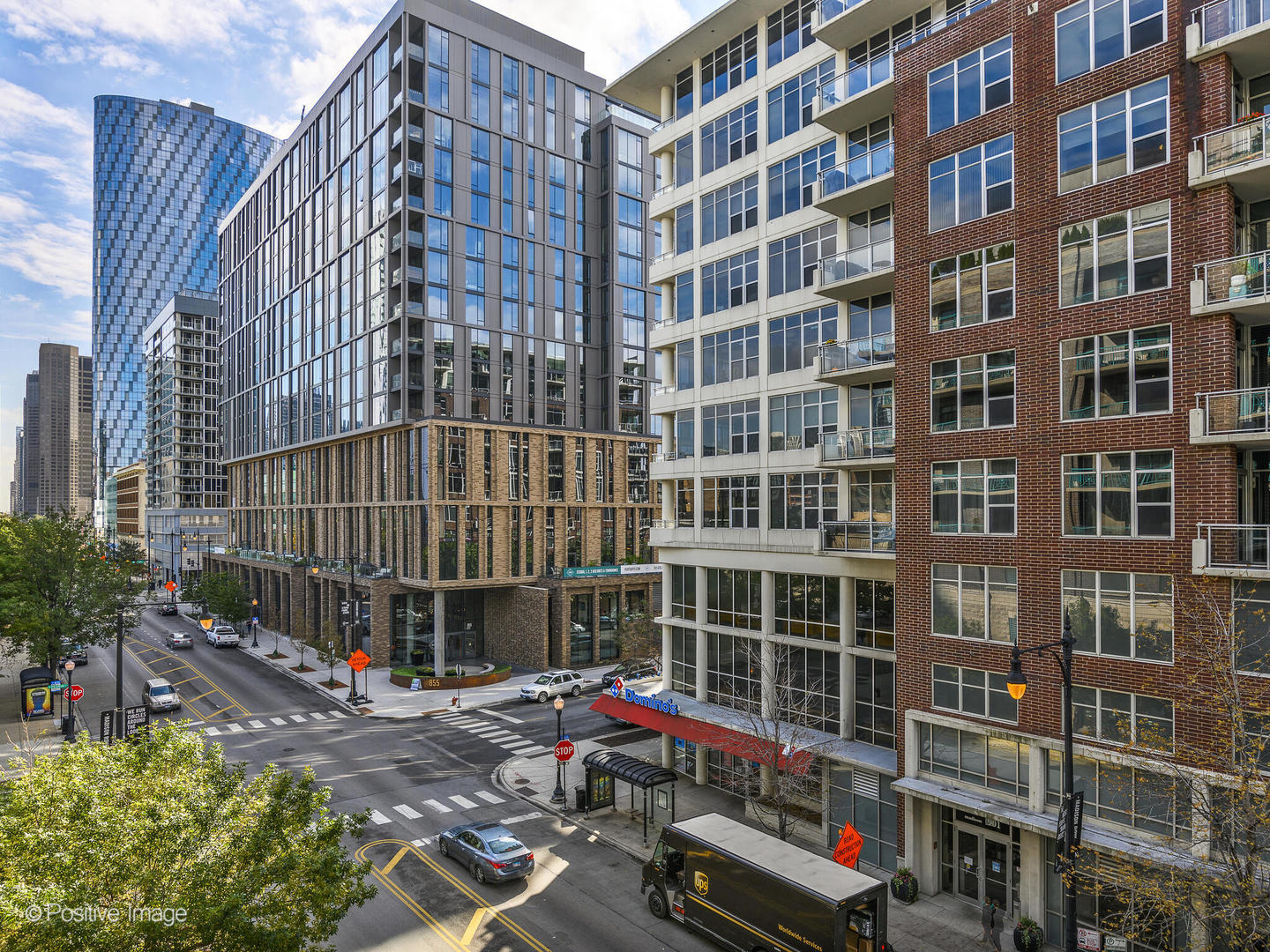 910 West Madison Street, Unit 403 Chicago, IL 60607 - Photo 12 of 12 a front view of a building with glass windows and some plants