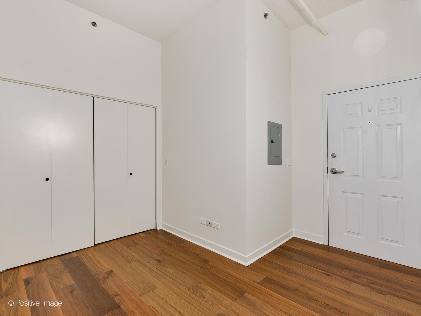 910 West Madison Street, Unit 403 Chicago, IL 60607 - Photo 2 of 12 a view of an empty room with wooden floor