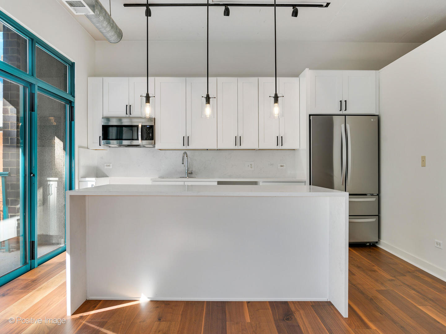 910 West Madison Street, Unit 403 Chicago, IL 60607 - Photo 6 of 12 a kitchen with stainless steel appliances a refrigerator sink and cabinets