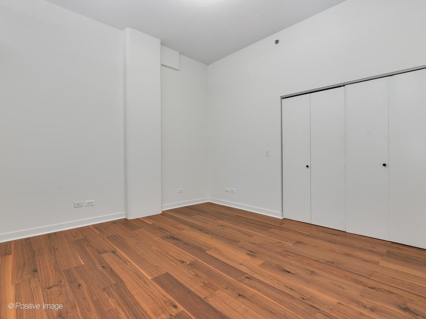 910 West Madison Street, Unit 403 Chicago, IL 60607 - Photo 8 of 12 a view of room with wooden floor