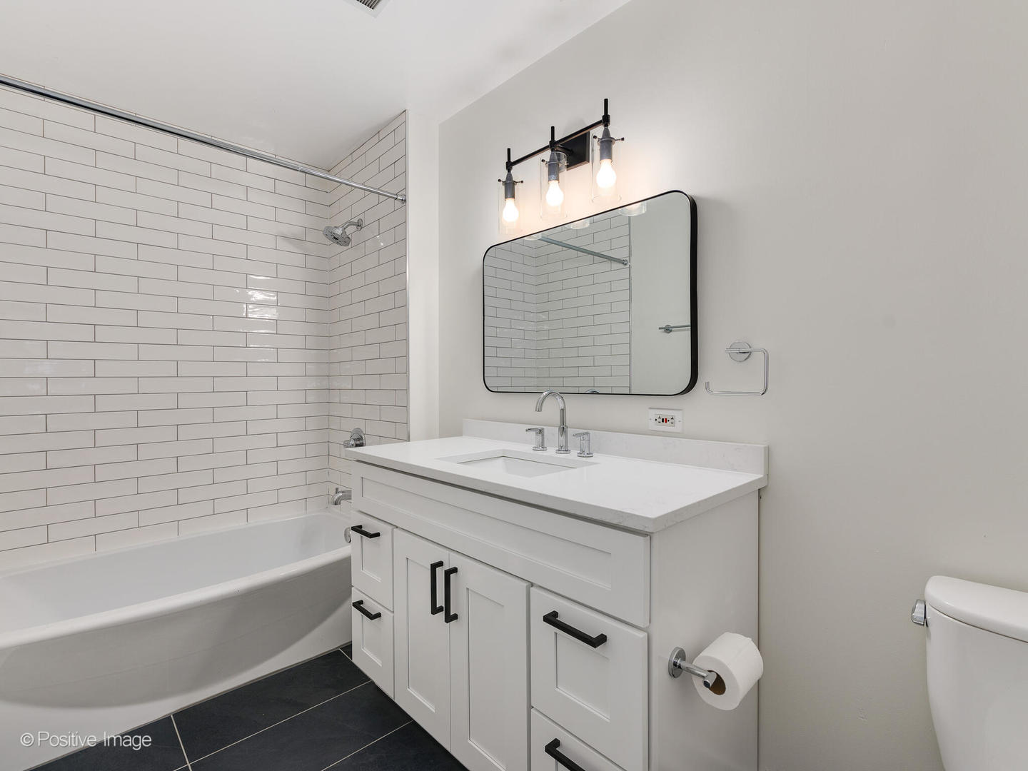 910 West Madison Street, Unit 403 Chicago, IL 60607 - Photo 9 of 12 a bathroom with a sink and a mirror
