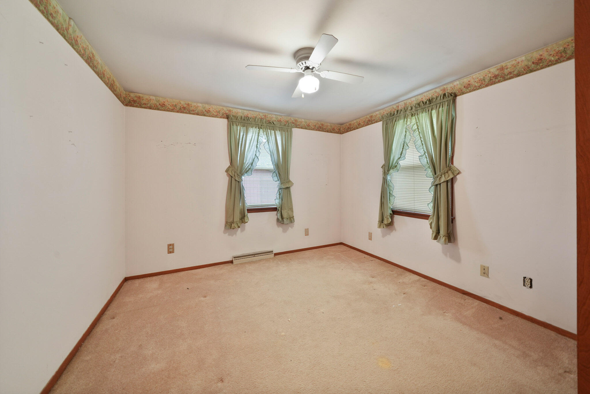 756 South 375 West Hebron, IN 46341 - Photo 13 of 21 an empty room with windows and ceiling fan