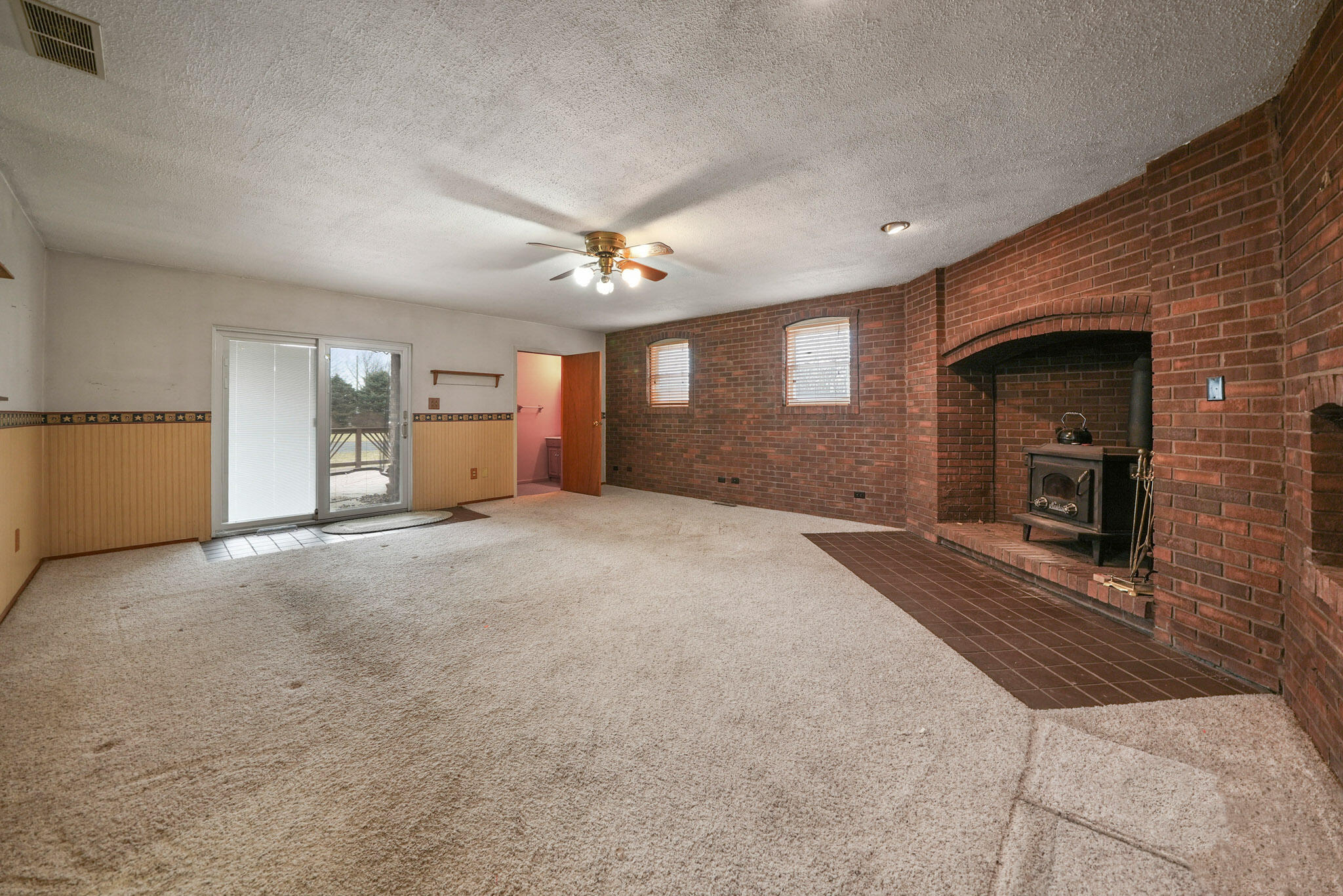 756 South 375 West Hebron, IN 46341 - Photo 9 of 21 a view of a livingroom with a fireplace and window