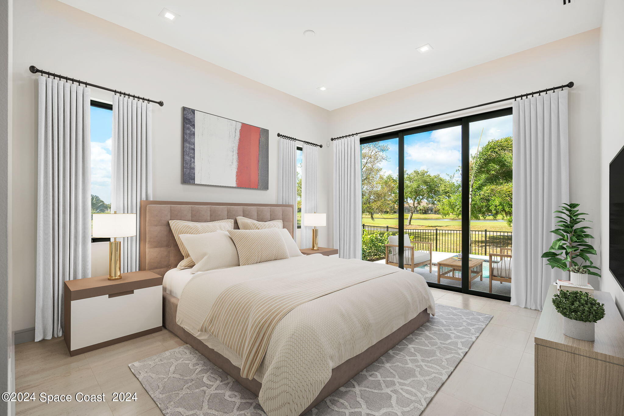 6374 Modern Duran Drive Melbourne, FL 32940 - Photo 16 of 55 a bedroom with a large bed and a large window