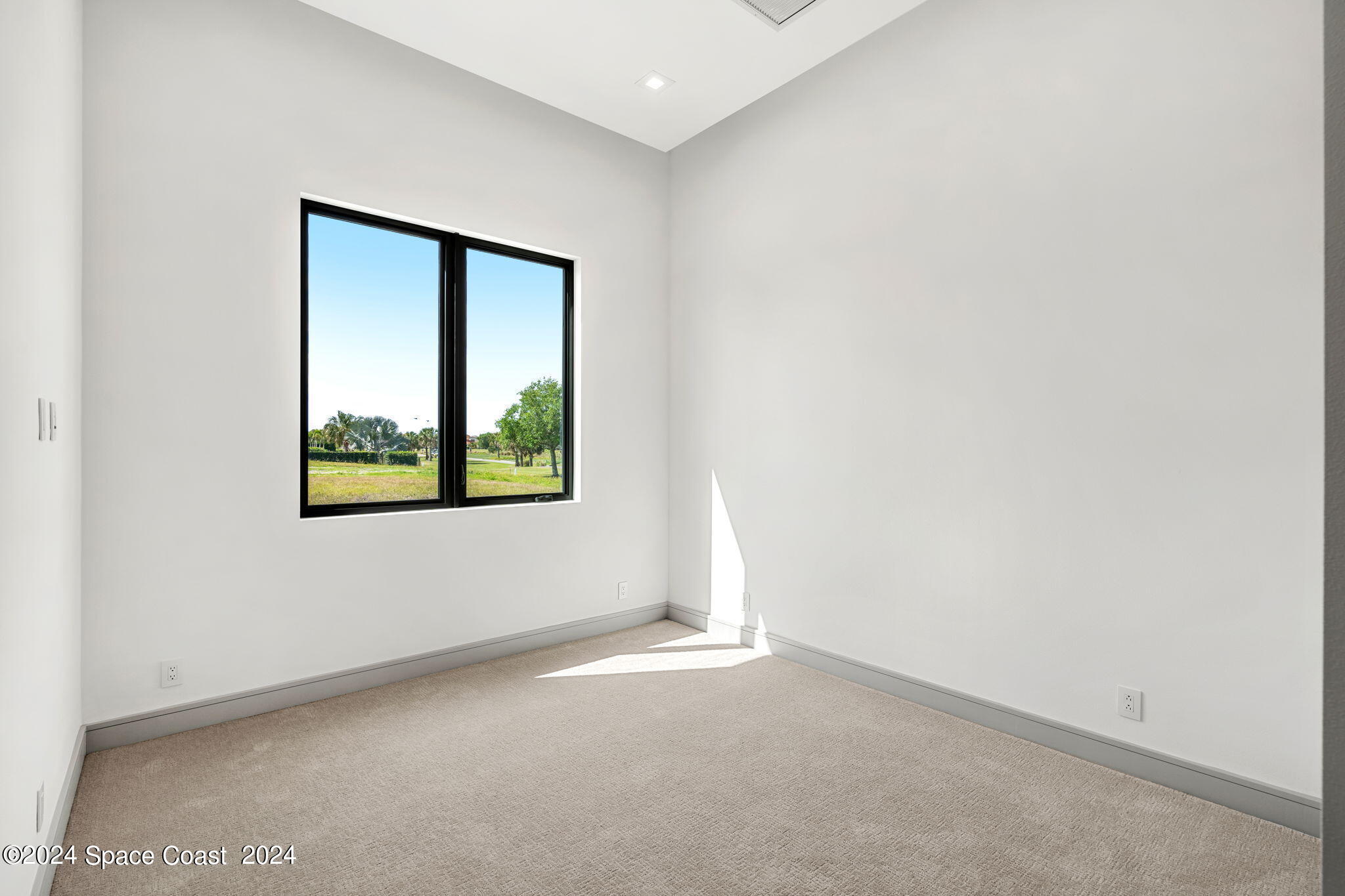 6374 Modern Duran Drive Melbourne, FL 32940 - Photo 25 of 55 an empty room with windows