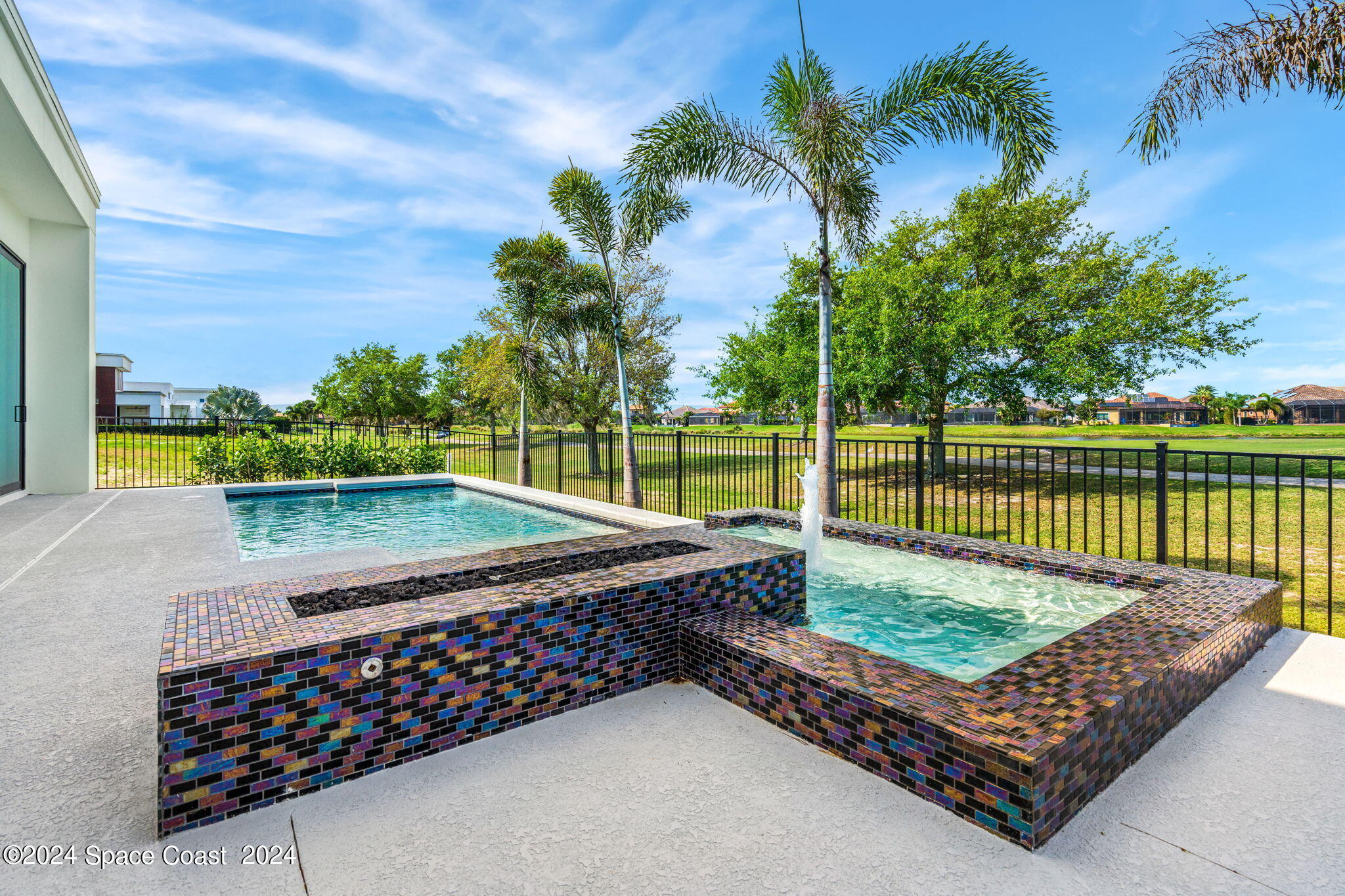 6374 Modern Duran Drive Melbourne, FL 32940 - Photo 35 of 55 a view of a roof deck with a wooden fence